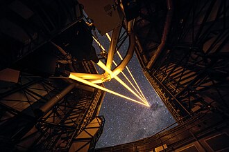 This image makes the Paranal Observatory's laser guide stars "meeting point" feel closer than it really is. In reality, the beams extend to an infinite distance. Most powerful laser guide star system, Paranal Observatory.jpg