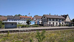 Station with island platform and two tracks