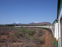 The Nairobi - Mombasa overnight train with Kilimanjaro on the horizon. Nairobi - Mombasa overnight train (delayed!), April 2009. (6112909805).jpg