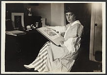 Nina E. Allender at desk