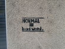 "Normal = bad word", a graffiti in Ljubljana, Slovenia Normal is a bad word.jpg