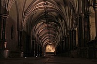 Norwich Cathedral cloister, a location in The Stalls of Barchester. Norwich Cathedral Cloisters in the Dark.jpg