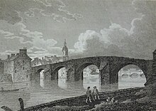 The old bridge across the River Ayr with the tolbooth steeple in the background, 1805 Old Brig of Ayr. 1805 engraving. South Ayrshire.jpg