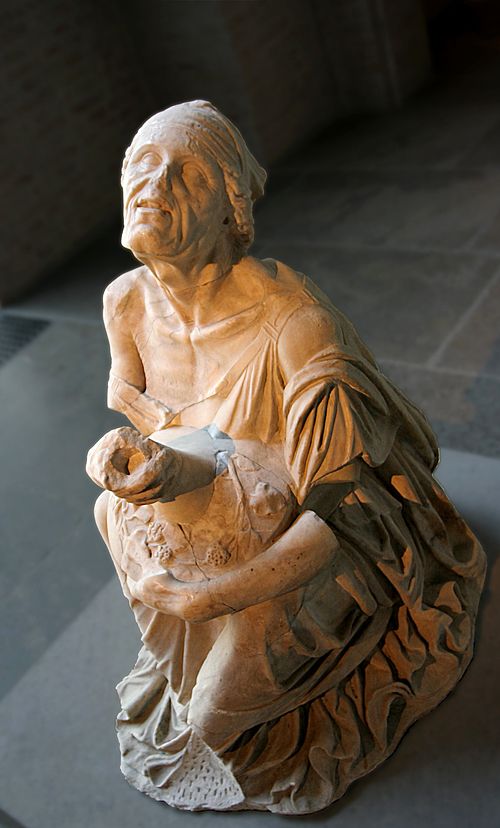 Ancient statue of a drunken old woman holding a jug of wine, 2nd century BC, Munich Glyptothek.