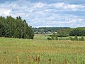 Polski: Widok na wieś Łaźnie z drogi Surażkowo–Łaźnie w pobliżu wsi Surażkowo, gmina Supraśl, podlaskie English: View on the Łaźnie village from the road between Surażkowo and Łaźnie villages, by the Surażkowo village, gmina Supraśl, podlaskie, Poland