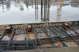 7. Post-tension cable ends extending from freshly poured concrete