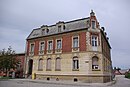 Post office with extension, courtyard building, courtyard paving and fencing