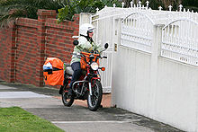 A Melbourne postman riding a CT110 Postie on motorbike - chadstone.jpg