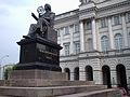 A statue of Copernicus stands outside the Polish Academy of Sciences.