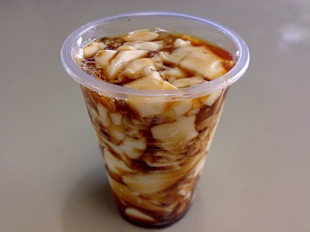 Taho, the Philippine version of douhua, served in a small plastic cup.