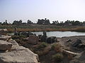 Vue du lac sacré Isherou bordé de statues de Sekhmet - Mut temple sacred lake view ; called "Isheru", it was surrounded with lion goddess Sekhmet statues