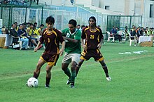 ONGC players in maroon, in action during a match in 2008. The Football player chasing the goal of the 121st Osian's Durand Football Tournament-2008 between the ONGC and Salgaocar SC, in New Delhi on August 23, 2008 (1).jpg