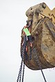 Trench safety - hardware rigging attached to backhoe (9247879269).jpg