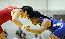 U.S. Army World Class Athlete Program wrestler Sgt. Iris Smith (right) defeats Chinas Lijun Yang.jpg