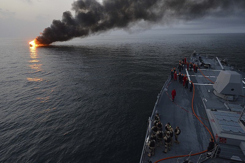 File:USS William P. Lawrence assists a burning vessel. (8558394504).jpg