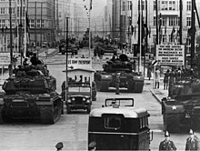 Soviet and American tanks face each other at Checkpoint Charlie during the Berlin Crisis of 1961. US Army tanks face off against Soviet tanks, Berlin 1961.jpg
