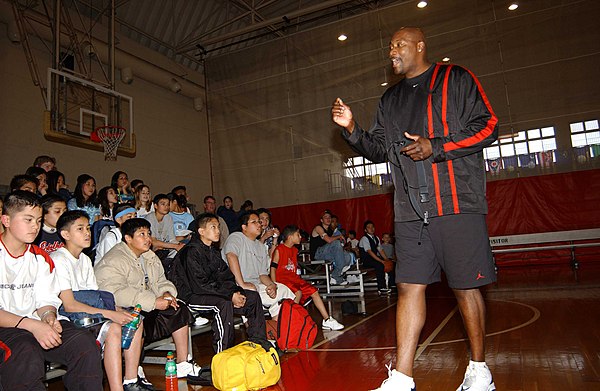 In 2003, Jerome Kersey addresses a group of kids on the basketball court in the Naval Air Facility at Atsugi, Japan