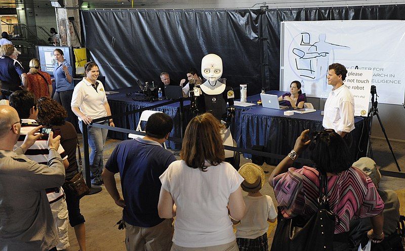 File:US Navy 100531-N-7676W-111 Lauren Gates, left, from the Office of Naval Research, and Greg Trafton, right, cognitive scientist with the Naval Research Laboratory, introduce Octavia to visitors during Fleet Week New York 2010.jpg