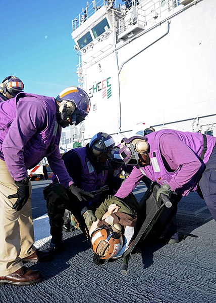 File:US Navy 111215-N-XX999-031 Sailors transport a simulated mass casualty victim during a fire drill.jpg