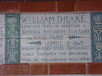 A tablet formed of six standard sized tiles, bordered by green flowers in the style of the Arts and Crafts movement