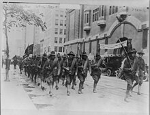 69th Regiment, New York National Guard, marching past armory entrance 69th Regiment, New York National Guard, marching past armory entrance, New York City LCCN2016651305.jpg