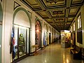 Interior hallway with military uniforms and equipment on display