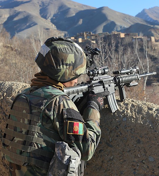 Image: An Afghan National Army soldier surveys a valley for suspicious activity during an operation in Ghorband district, Parwan province, Afghanistan