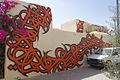 Art de rue Djerba quartier Er Ryadh Calligraphie orange.JPG