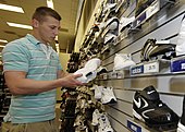 A U.S. Army soldier shops for shoes at the base exchange (BX) at Scott Air Force Base in May 2008. BaseExchange.jpg