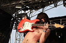 Lead singer Simon Neil performing live with the band in 2008 Biffy Clyro 001.jpg