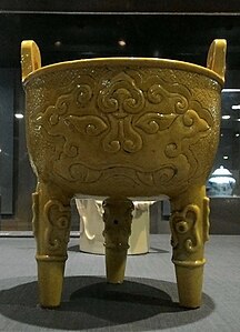 Mascaron on a bright yellow cauldron, before the 17th century, ceramic, National Palace Museum, Taipei, Taiwan