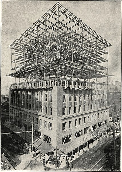 Photo of the Wainwright Building during construction revealing the steel frame interior.