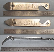 Contemporary church key, three views. The left end is a can piercer and the right end is a bottle cap lifter. Churchkey patent 1996550.jpg