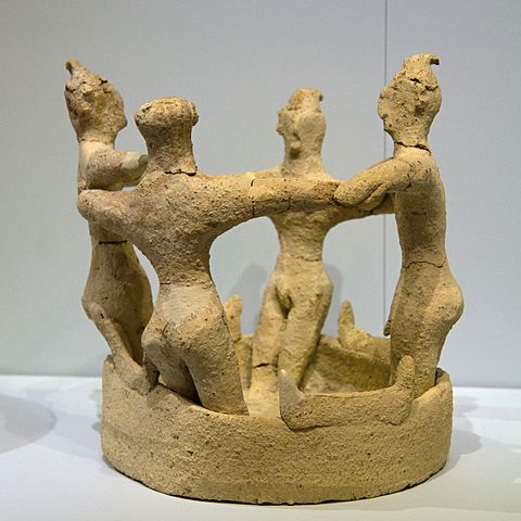 Terracotta model of people in a horned vat