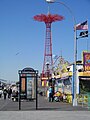 Coney Island's Riegelmann Boardwalk and Parachute Jump on a sunny morning.
