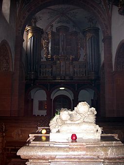 Tomb of Hermann Joseph (note the apple), with the Konig-Orgel in the background Convent Steinfeld Organ.jpg