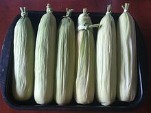 Corn on the cob prepared for roasting in oven.jpg