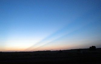 Photo was taken in western Oklahoma and shows crepuscular rays caused by the Rocky Mountains, 250 km (160 mi) away