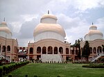 Kali mandir facade, from the main access direction, with Shiva (left) and Radhakrishna (rt) temples. The temples themselves open on the other side.