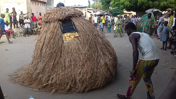 Local ceremony in Benin featuring a zangbeto.