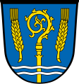 Postmünster címere