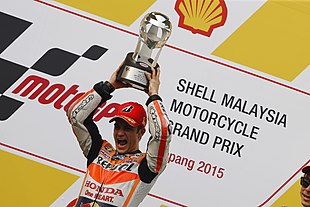 Dani Pedrosa, celebrating on the podium after winning the MotoGP race. The race was controversial due to the collision between Marc Marquez and Valentino Rossi. Dani Pedrosa 2015 Sepang.jpeg