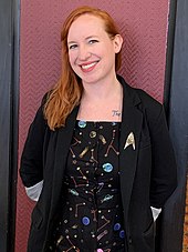 Science consultant Erin Macdonald mapped out the season's time travel storyline, and also has a cameo role in the season finale. Dr. Erin Macdonald.jpg