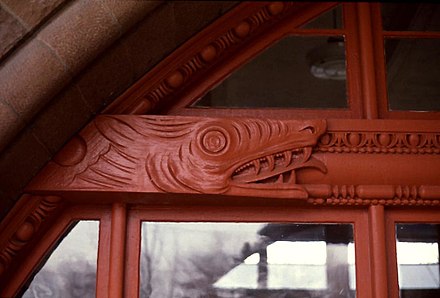 Detail from Old Colony Railroad Station showing a dragon carved in the beam of a glazed Syrian arch