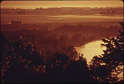 EARLY MORNING VIEW OF THE MISSOURI RIVER FROM THE ABBEY OF BENEDICTINE COLLEGE AT ATCHISON, KANSAS. THE ABBEY IS... - NARA - 557091.jpg