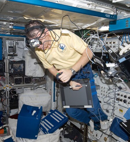 An astronaut on board the International Space Station is wearing a head-mounted display for performing a space neuroscience experiment aimed at evaluating changes in perceived depth and distance. Figure1oto.jpg