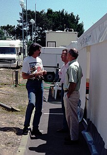 Gordon Murray chats in the paddock behind the pits at the 1996 Le Mans (51816281021).jpg