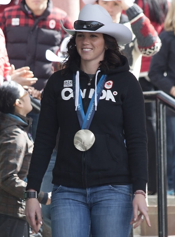 Helen Upperton displays the silver medal she won in the two-woman competition.