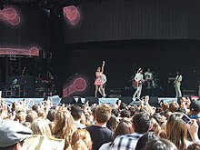 Katy Perry performing during the inaugural edition of the ball. Katy Perry at Capital FM's Summertime Ball (3605436476).jpg