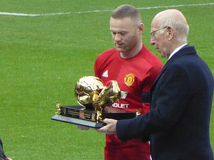 Wayne Rooney receiving an award for becoming the club's record goalscorer from previous record holder Sir Bobby Charlton in January 2017